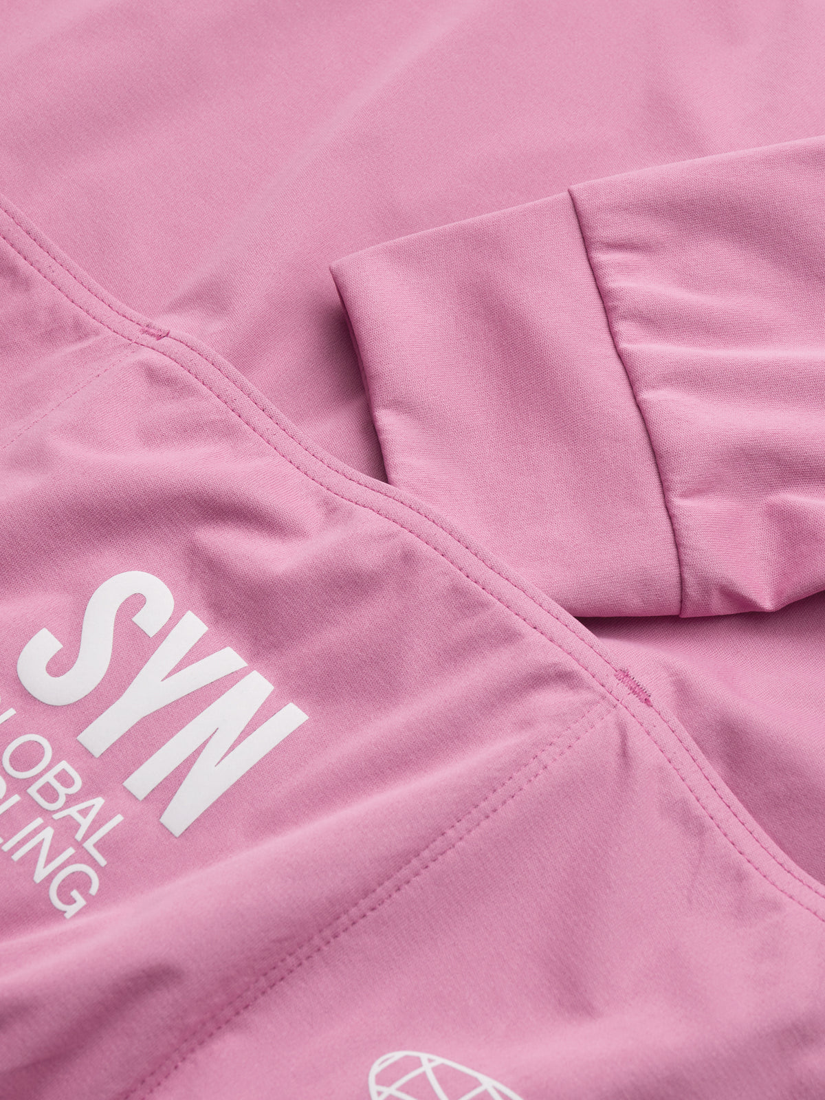 SYN Men's Pro Team APEX Club Jacket 2.0 - Blush - closeup - PRO_TEAM_APEX_CLUB_JACKET_W_BLUSH_DET1